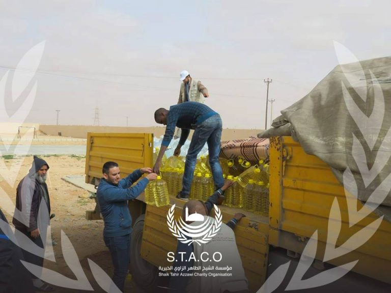 Distributing aid to displaced Tawerghans